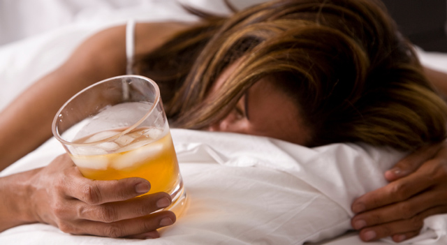 woman drunk on her bed 